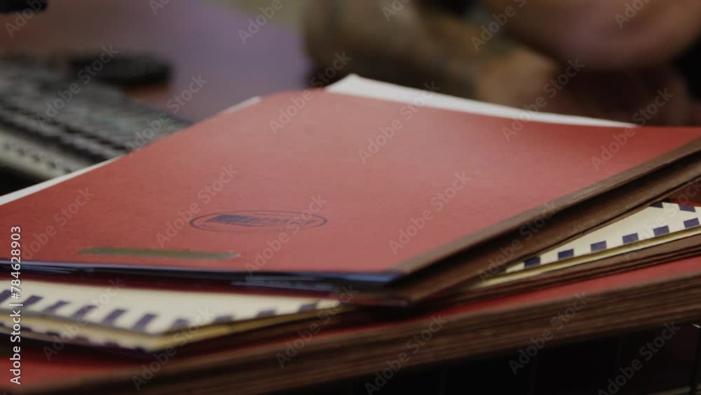 Police officer closing a case at his desk Police officer closing a case at his desk