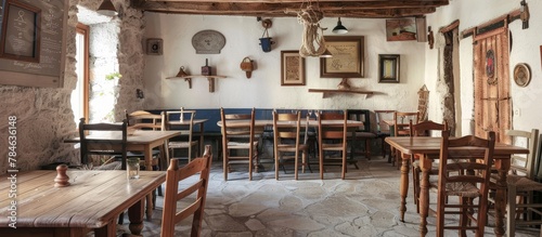 Rustic wooden furniture with simple, durable decor captures the essence of a traditional Greek Taverna.  photo