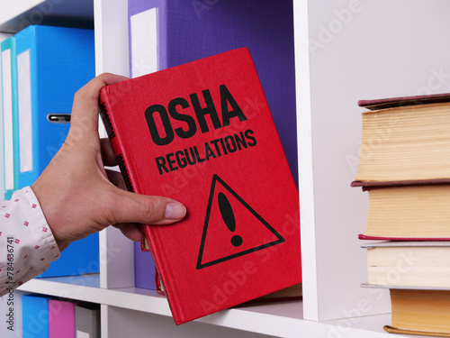 OSHA Regulations. Occupational Safety and Health Administration - safe workplace concept photo