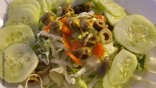 Cucumber Salad With Olives. Chopped Shredded Lettuce For Lunch