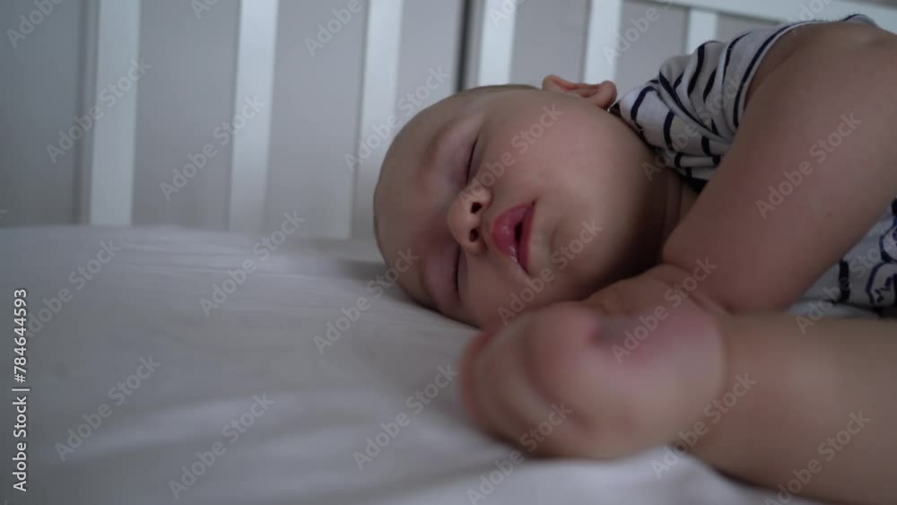 Sleeping like a newborn. Healthy happy little infant relax on  cozy bed nap, tiny . Cute baby dreaming well in comfy clothes enjoy safety comfort silence at bedroom. 