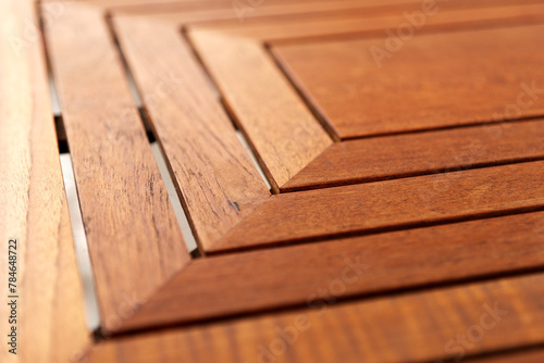 Edge and corner of wooden table. Closeup