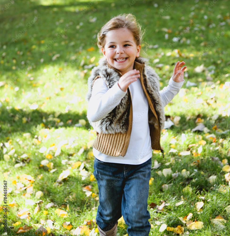 Happy little girl at autumn park Happy little girl at autumn park