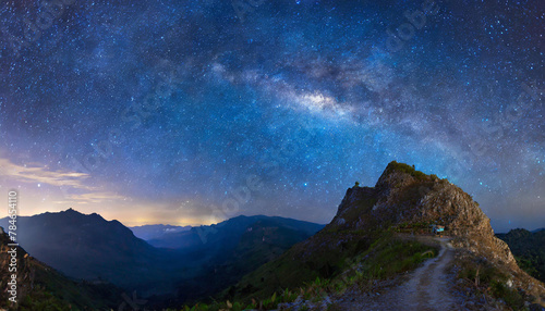 Beautiful milky way and mountain peak. Dark blue starry sky. © hardvicore