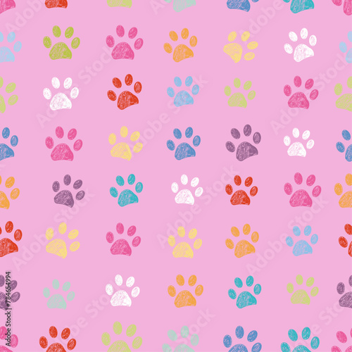 Pink background and dots with colorful paw prints. Seamless fabric design pattern