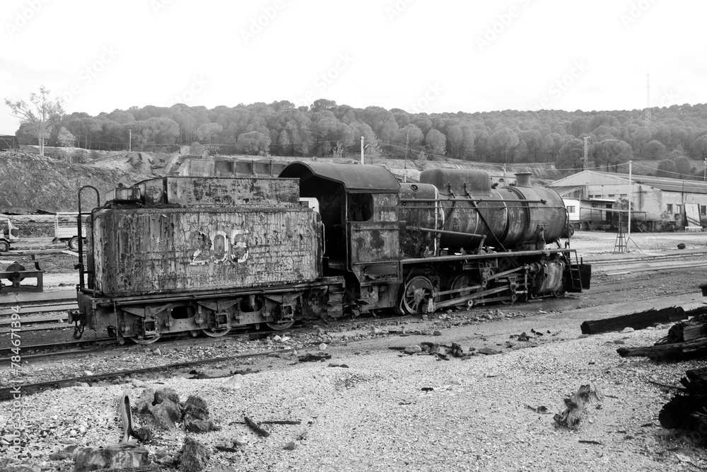 Naklejka premium abandoned rusty locomotive on a track
