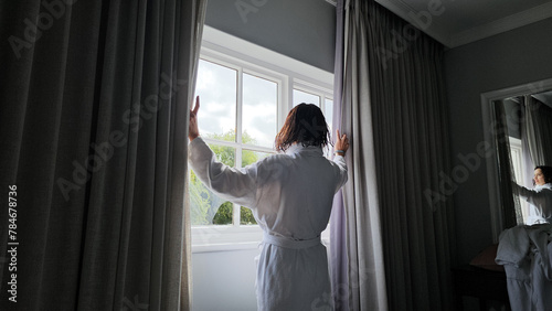 Woman Standing in Front of Window