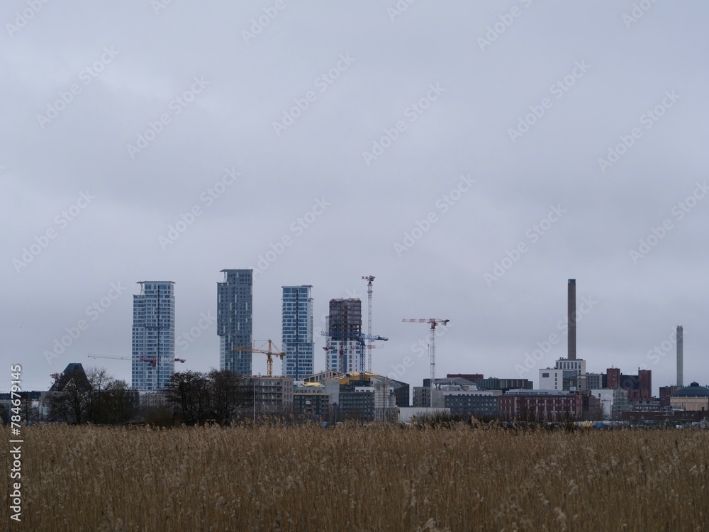 A construction site on the far horizon. Tall skyscrapers Helsinki, Finland. A construction site on the far horizon. Tall skyscrapers Helsinki, Finland.