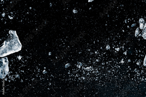 A shards of crushed ice on a black background.
