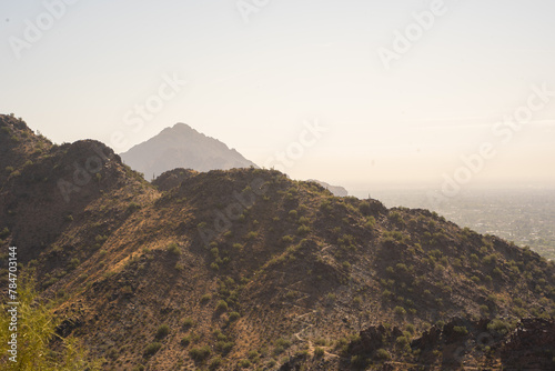 Misty Desert mountains overlooking City