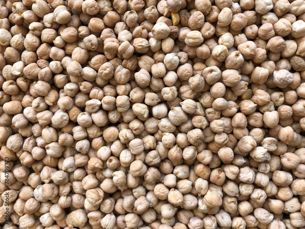 Dry organic chickpeas as background close up. Heap of white chickpeas. Food background. Biological food. Dry organic chickpeas as background close up. Heap of white chickpeas. Food background. Biological food.