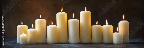 Light white candles on a dark background