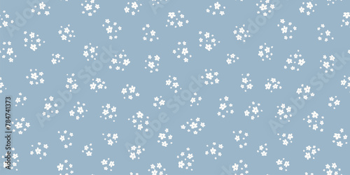 Subtle ditsy pattern. Simple vector blue and white seamless ornament with small flowers. Elegant abstract floral background. Minimalist texture. Repeated design for decor, fabric, wallpaper, print