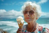 Elder woman in a floral shirt holding an ice cream cone. She is smiling and enjoying the moment