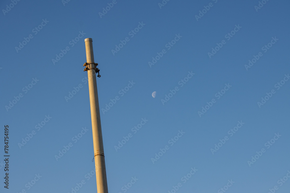 Pole without lamp or electricity and a moon