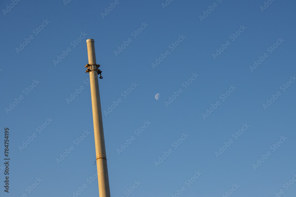 Pole without lamp or electricity and a moon Pole without lamp or electricity and a moon