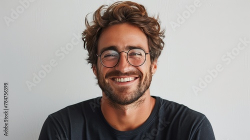 Smiling Man With Glasses in Black Shirt