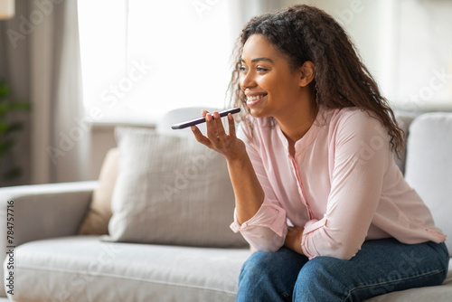 Lady talking on phone using speaker mode