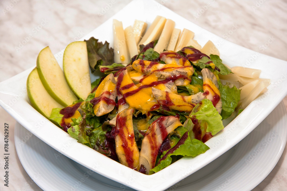 Pear and vegetable salad with mango and strawberry dressing, fresh green salad Pear and vegetable salad with mango and strawberry dressing, fresh green salad