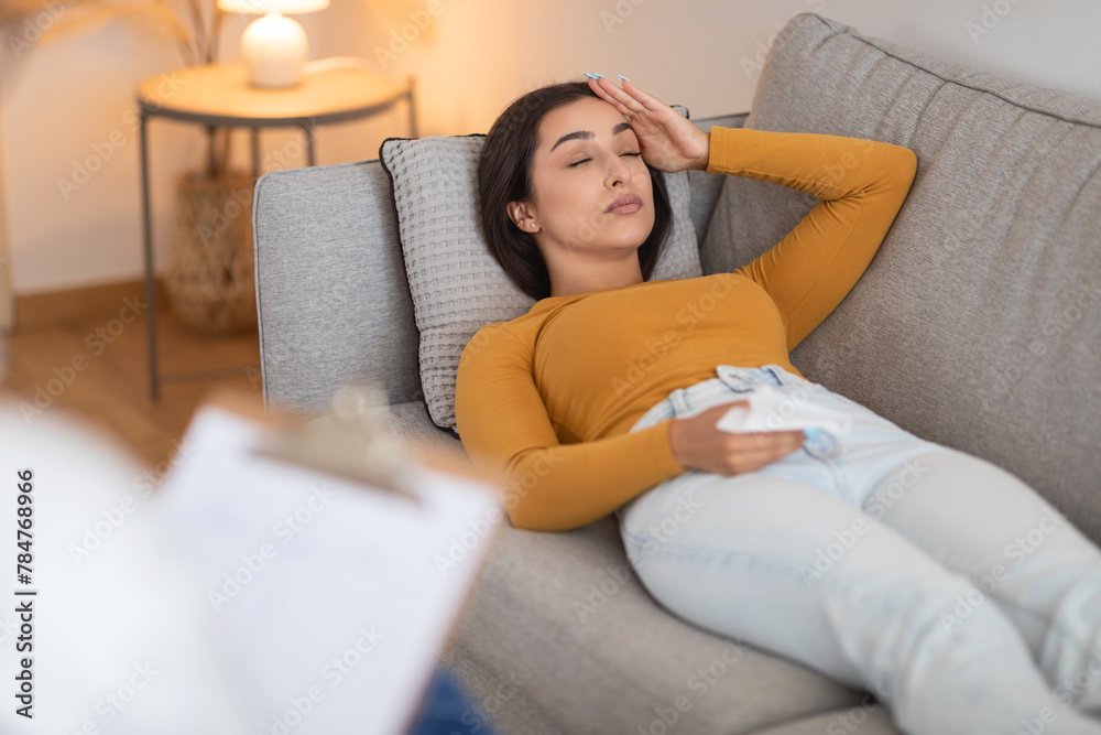 Woman with eyes closed during a therapy visit Woman with eyes closed during a therapy visit