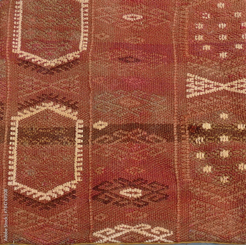 Turkish kilim with orange and brown, red patterns photo