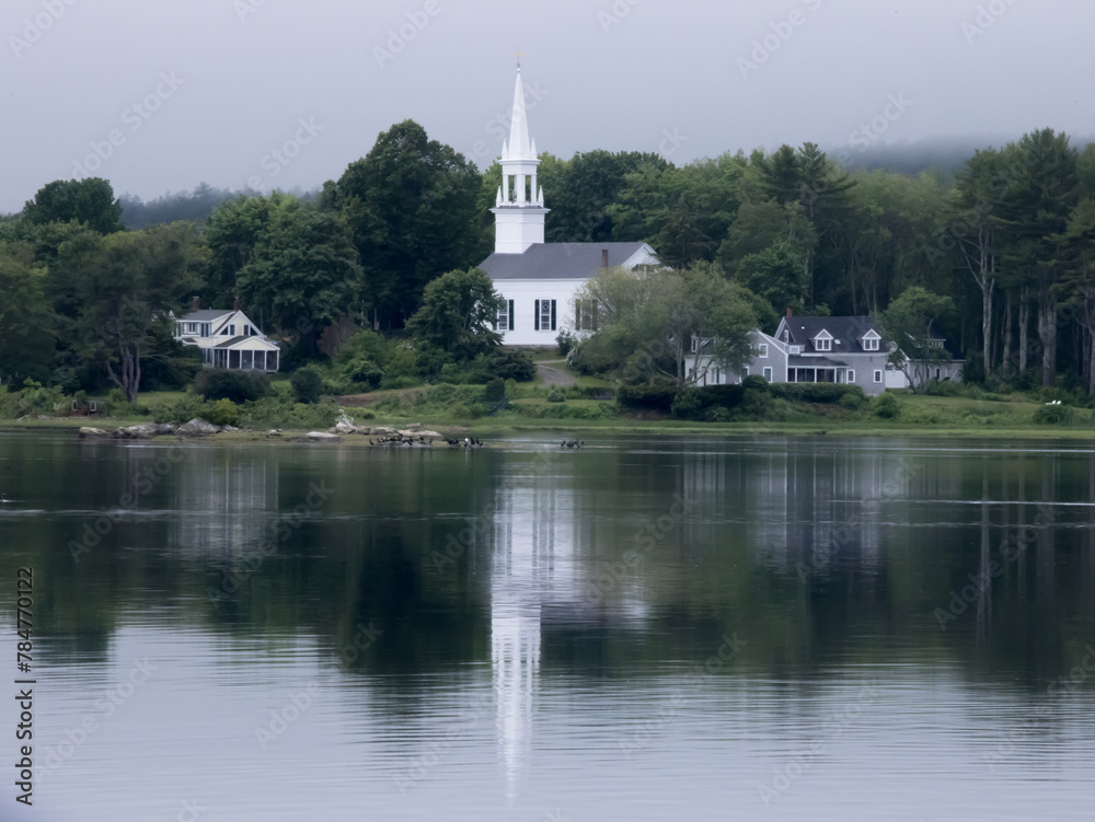 White church on a river bank