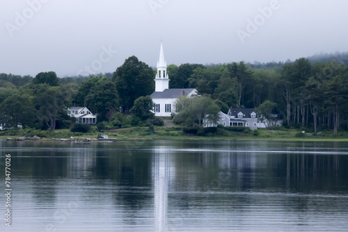 White church reflected in a river © Allen Penton
