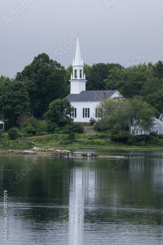 White church reflected in a river