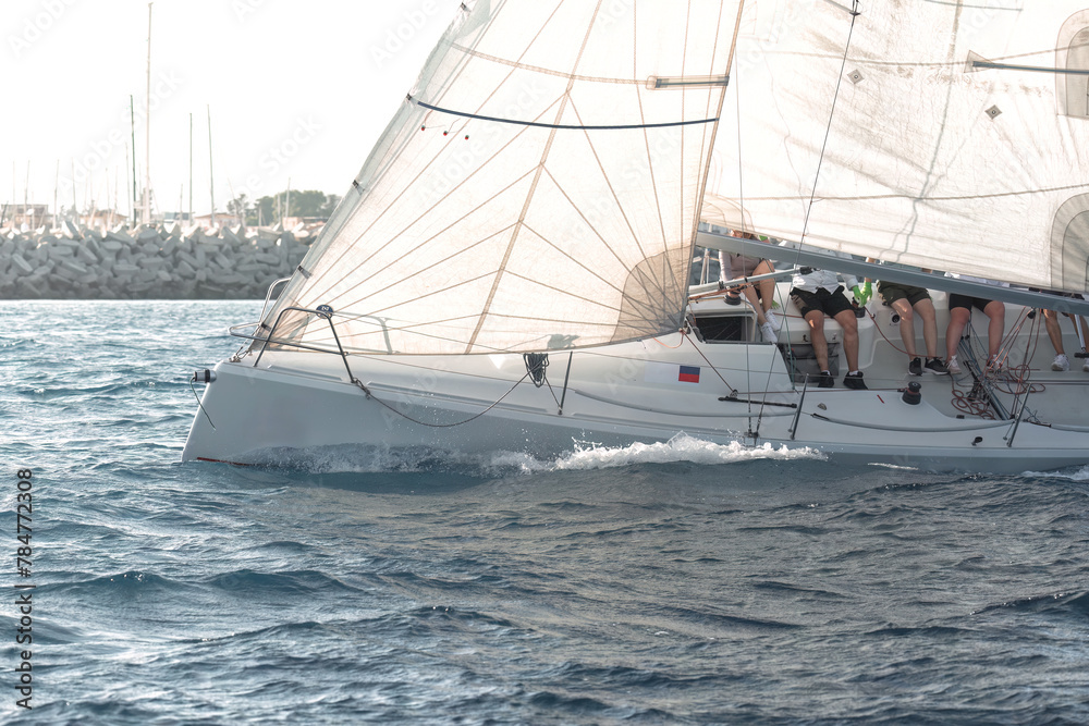 Obraz premium Yacht racing in the serene mediterranean sea during a regatta event