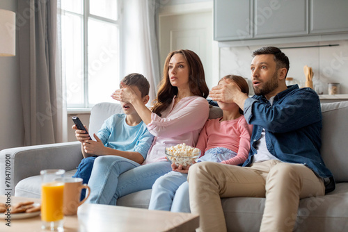 Family with varied reactions to onscreen content