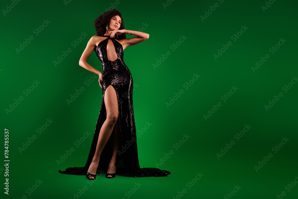 Photo of elegant charming lady in sparkling dress posing for vogue magazine cover over green gradient color background