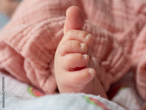 close-up of a newborn baby's leg. Selective focus. New life concept