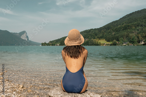 Woman sunbathing at the Mondsee lake in Austria
