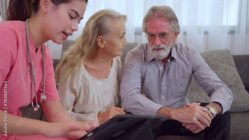 Compassionate young nurse assists an elderly couple with healthcare needs in their comfortable living room. Compassionate young nurse assists an elderly couple with healthcare needs in their comfortable living room.