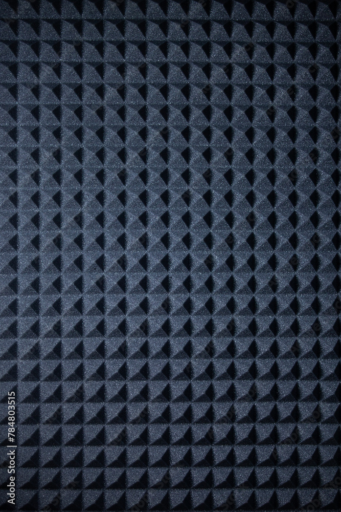 Background of sound absorbing sponge. Wall soundproofing. Pyramid style padding layer panel for voice recording.