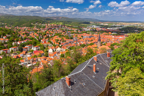 Aerial view of Wernigerode with distinctive red roofs and lush Harz foothills, Germany