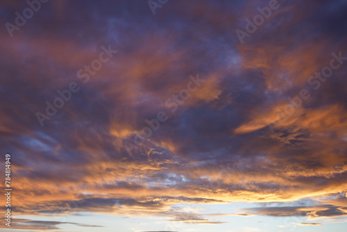 Fiery orange sunset sky with red clouds. Beautiful sky.