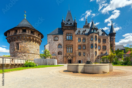 Wernigerode Castle with fountain and defensive tower in Wernigerode, Germany