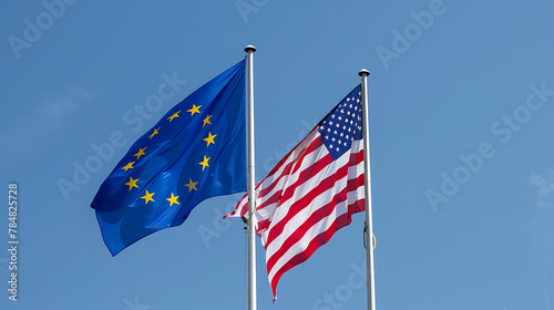 An image featuring the flags of the European Union and the United States of America side by side, waving in the breeze against a backdrop of clear blue sky.