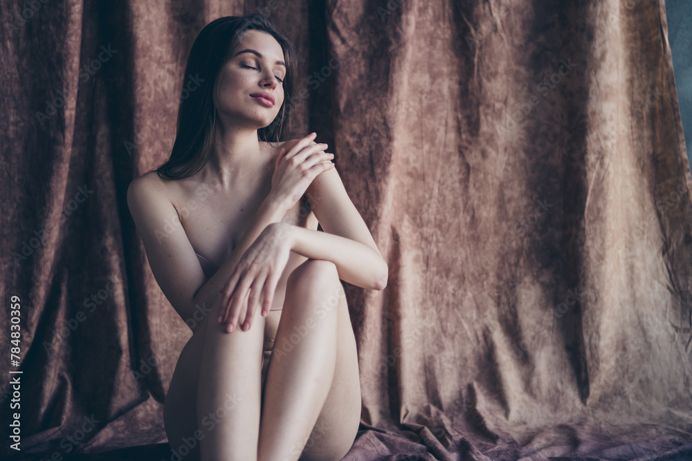 Fototapeta premium Photo no filter of gorgeous stunning girl touch applying beauty product on skin body isolated studio background