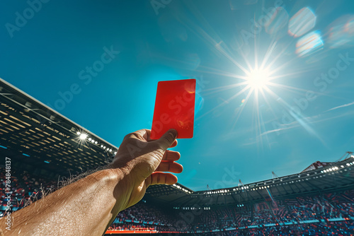 a referee hand is holding a vertical red card in a stadium,generative ai