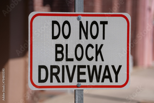 do not block driveway street sign downtown on a sunny day © John