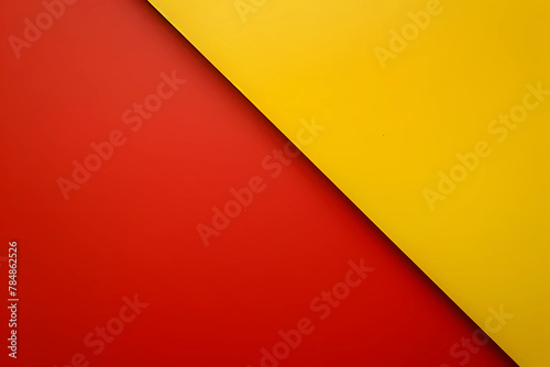 A boldly vibrant background, bisected by a striking diagonal line, divides into two contrasting halves - a luscious deep red on the left and a sumptuously rich yellow on the right photo