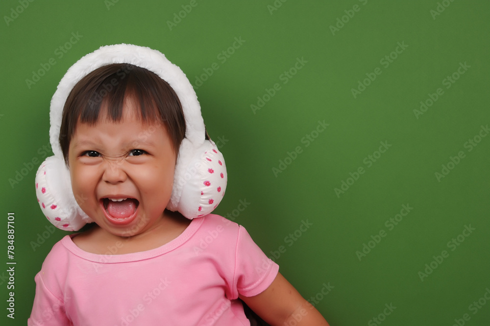an Indonesian little girl wearing headband an Indonesian little girl wearing headband