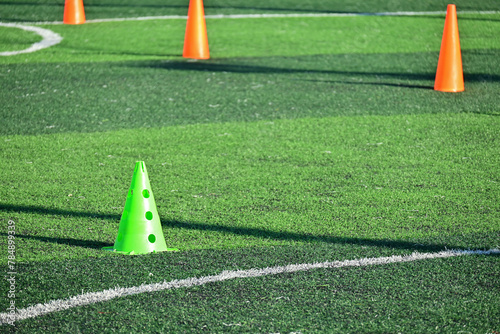 artificial green grass soccer field with training cones