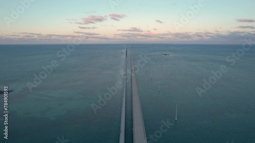 Seven Mile Bridge Sunset in Florida Keys Aerial View. Fly Over American Bridge Over Blue Ocean Pastel Colored Sky photo