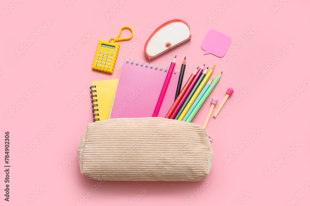Beige pencil case with different school stationery and notebooks on pink background - obrazy, fototapety, plakaty 
