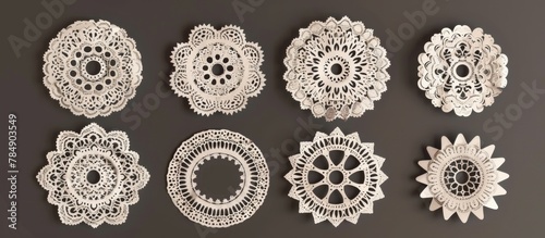 Several delicate doilies are displayed on a wall, creating a charming and vintage decoration