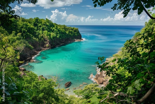 A panoramic view of a secluded cove with crystal-clear turquoise water, fringed by lush greenery and a hidden waterfall © ktianngoen0128