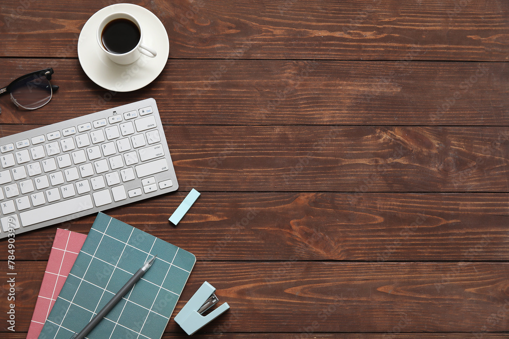 Computer keyboard, cup of coffee and stationery on wooden background Computer keyboard, cup of coffee and stationery on wooden background
